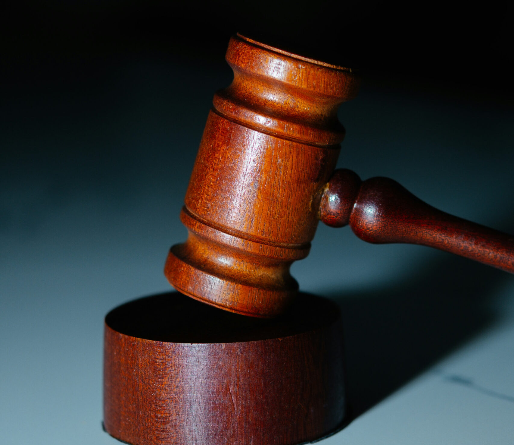 Wooden judge’s gavel on a sounding block Wooden judge's gavel on a sounding block